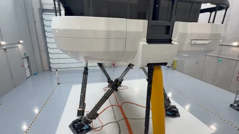Advanced Full-motionn Flight Simulator in Operation, with a View of Lower Part Stock Footage 337578211