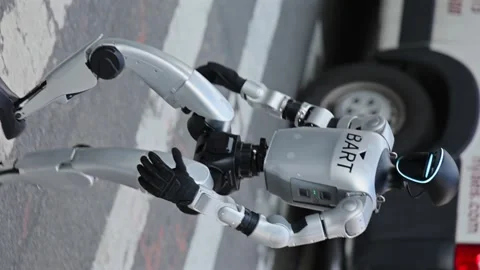 Advanced humanoid robot walking in Manhattan in the day. People watch in Stock Footage 332890738