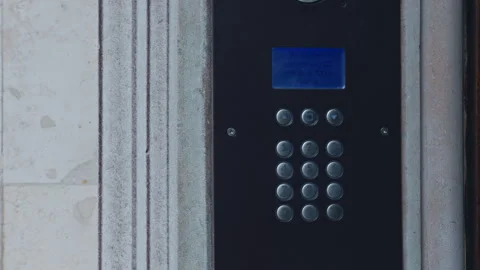 Advanced Modern Intercom System featuring a Keypad located at the Building Stock Footage 289916781