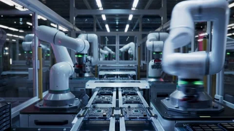 Advanced Robotic Arms Assemble Electronics on Modern Production Line Stock Footage 332634202