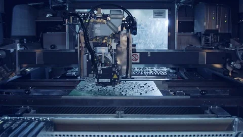 Advanced SMT Machine places components on a circuit board Stock-Footage 98752746