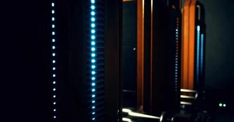 Advanced technology setup featuring glowing panels in a dark environment Stock Illustration