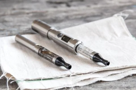 Advanced vaping device, e-cigarette on table Stock Photos