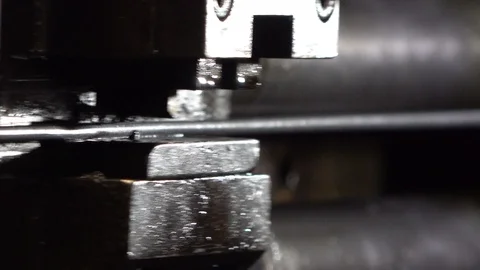 Advancement of the metal wire on a bending machine Stockbeeldmateriaal 111902013