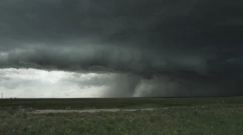 Advancing outflow and shelf cloud of a severe thunderstorm above the prairie Stock Footage 59143220