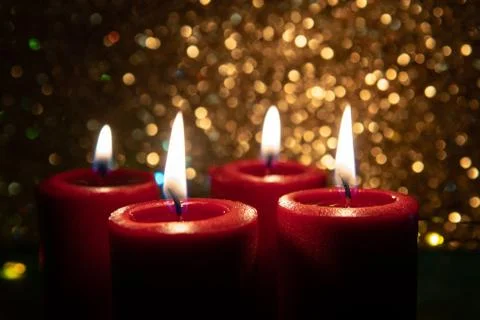 Advent theme with 4 burning red candles. Christmas decoration. Stock Photos