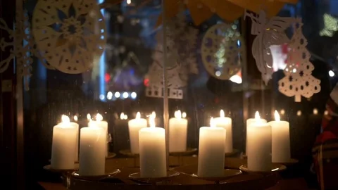 Advent white candles over that revolve decorations made of plywood depicting  Stock Footage 78219720