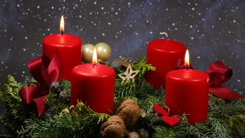 Advent wreath with 3 burning candles on turn table Stock Footage 166570838