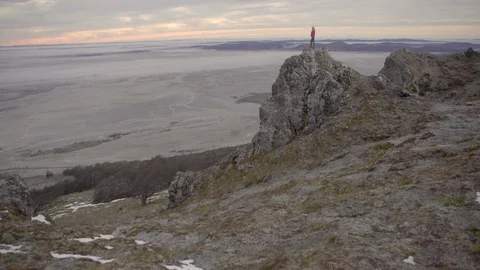 Adventure explorer celebrating at summit of mountain in Chile Patagonia  Stock Footage 104188814