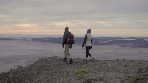 Adventure explorer hikers pointing at summit of mountain in Chile Patagonia  in  Stock Footage 104188891