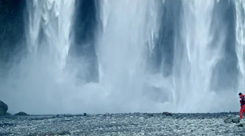 Adventure man waterfall Stock Footage 53087028
