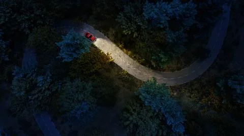 Adventure night road trip in the forest, aerial view of a car headlights on d Stock Illustration