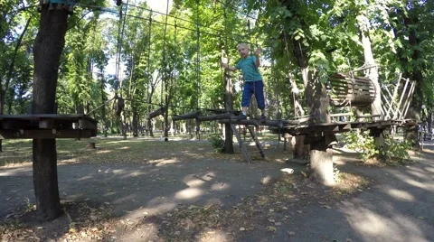 Adventure park. Extreme sport. Children climbing. Video stock 59143942