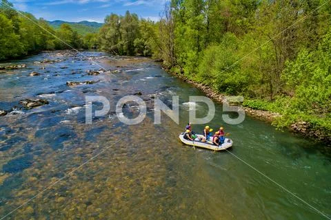 Adventure team doing rafting on the cold waters of the Nestos River Stock Photos
