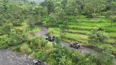 Adventure Travel on Mount Merapi Group Joyride in a 4x4 Jeep Yogyakarta Stock Footage 310032948