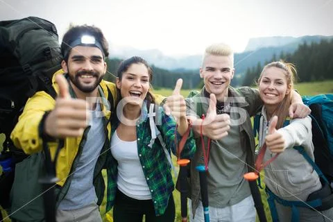 Adventure, travel, tourism, hike and people concept - group of smiling friends Stock Photos