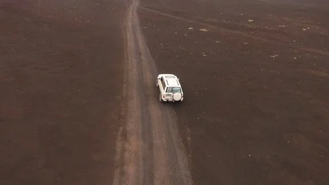 Adventures on the SUV. The road through the volcano. Jeep rides through the lava Stock Footage 72680494