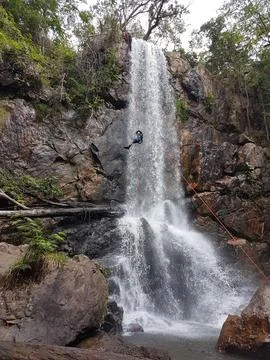 Adventurous climber at waterfall Stock Photos