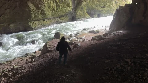 Adventurous explorer walking inside Weaver Cave, or Tkalca jama, in Slovenia 動画素材 337950012