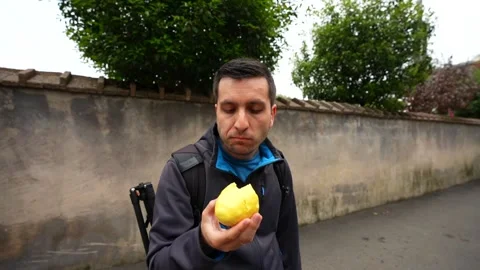 Adventurous man eating a local bread in China Stock Footage 335266381