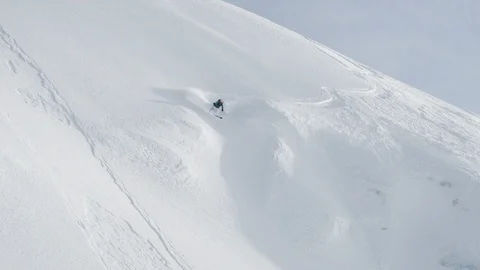 Adventurous skier skiing ahead avalanche on the high mountains Stock Footage 116626609