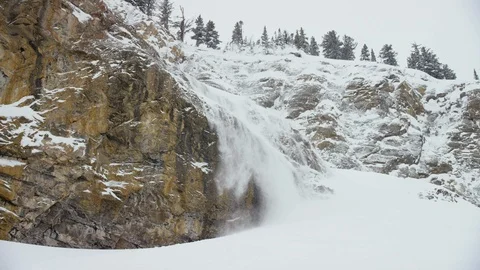 Adventurous skier skiing down snow covered mountainside Stock Footage 116746171