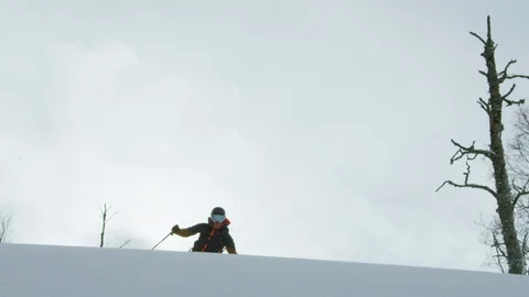 Adventurous skier skiing through snow covered slopes Stock Footage 116787116
