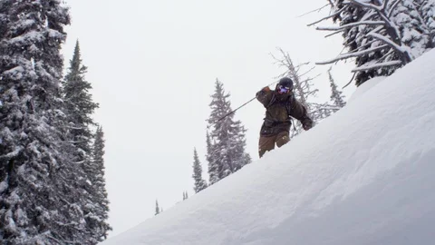 Adventurous skier spinning while skiing downhill Stock Footage 116738644