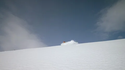 Adventurous skiers skiing down the snow-covered slope in slow motion Stock Footage 116786870