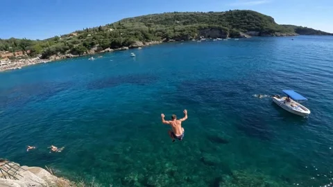 Adventurous young man jumping in Greece ,adventurous lifestyle Stock Footage 257754964