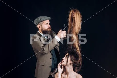 Advertising and barber shop concept. Hair Stylist and Barber. Woman getting Stock Photos