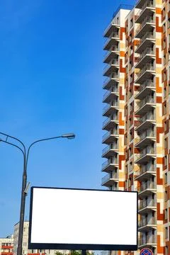Advertising canvas layout on the background of a multi-storey building and a Stock Photos