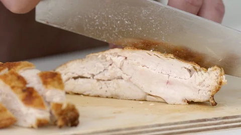 Advertising of a sharp knife for meat in slow motion Stock Footage 93778354