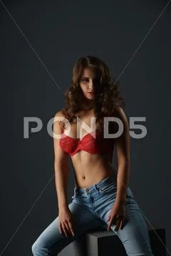 Advertising Underwear. Hot Brunette Sits On Cube