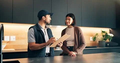 Advice, client and clipboard with plumber in kitchen for invoice agreement Stock Photos