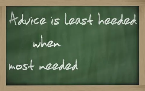 " advice is least heeded when most needed " written on a blackboard Stock Photos