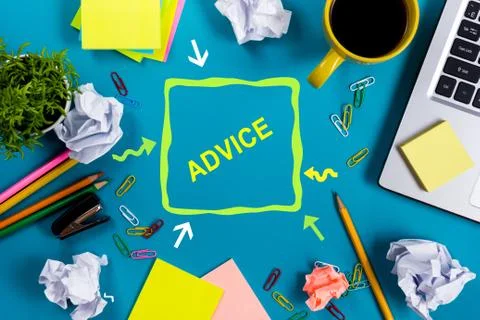 Advice motivation. Office table desk with supplies, white blank note pad, cup Stock Photos