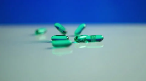 Advil Liquid Gels Dropping in Slow Motion. Stock Footage 58413729