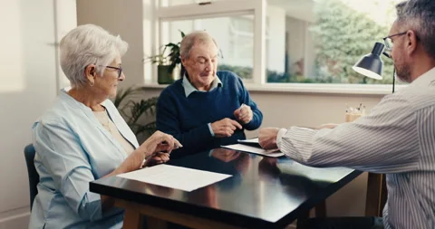 Advisor, old couple and writing at house with document, application and Stock Footage 342096078
