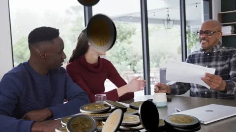Advisor tapping laptop starting coin overlay on table as woman shaking hands Stock Footage 338356310