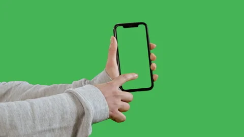 Ady using device with green screen Stock Footage 228591235