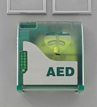 Aed defibrillator at wall Stock Photos