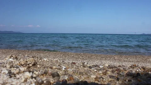 Aegean Sea in Greece. Empty beach with stones. Including the noise of the waves. Video stock 102307476