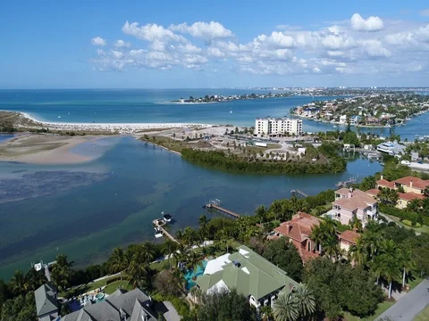 Aeiral flyby of mansions and Pass-A-Grille in St. Pete Beach, FL. Stock Footage