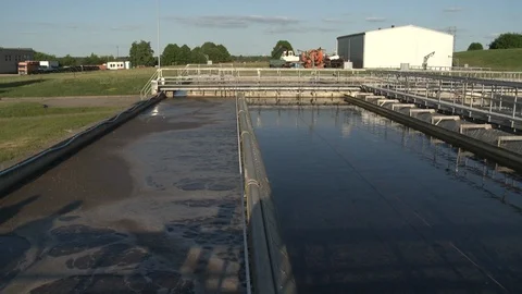 Aerated activated sludge settle tank at waste sewage water treatment plant Stock Footage 109639719
