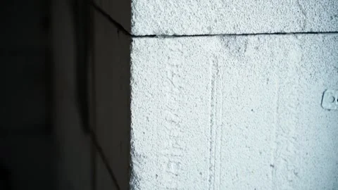 Aerated concrete brick wall close-up. Window opening in the gas block wall Stock Footage 233101281