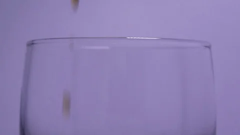 Aerated Powder Water Is Drawn into Glass Stock Footage