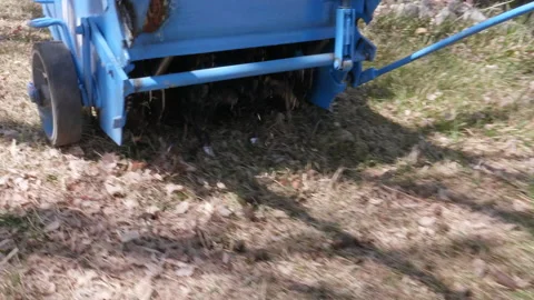 Aerator driving on lawn Stock Footage 164407525