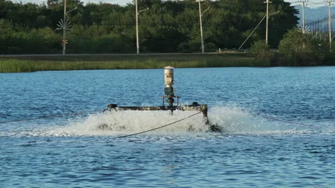 Aerator oxygen turbine, Equipment for adding oxygen in the water in the pond. Stock Footage 229704575
