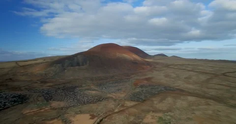 Aereal paning view of volcanic mountain in majanicho fueteventura Stock Footage 105063397
